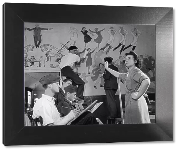 Convalescent soldiers painting a fresco on the wall of a hospital building near