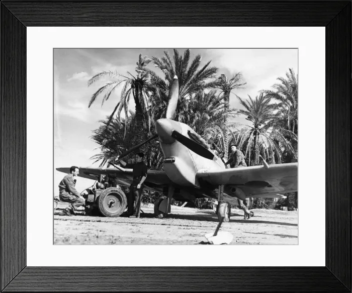 Framed Print : R. A. F. ground crew work on a Spitfire at a forward aerodrome in Tunisia. 12th March 1943 Framed Print : R. A. F. ground crew work on a Spitfire at a forward aerodrome in Tunisia. 12th March 1943