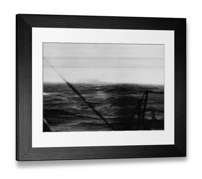 Framed Print : The German battleship Bismarck burns on the horizon approximately 350 miles west of