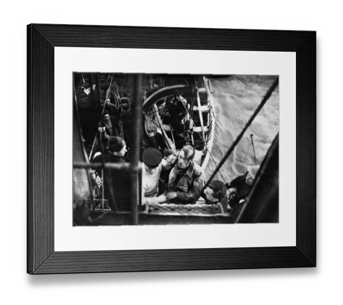 Framed Print : The pilot of a German Heinkel Bomber plane of the Luftwaffe is brought aboard a British Framed Print : The pilot of a German Heinkel Bomber plane of the Luftwaffe is brought aboard a British