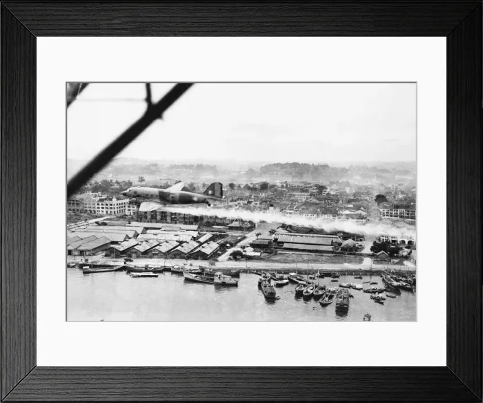 Framed Print : An R. A. F Dakota spraying the city of Singapore with D. D Framed Print : An R. A. F Dakota spraying the city of Singapore with D. D