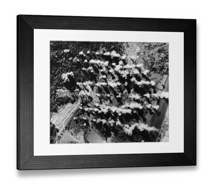 Framed Print : High explosive and sticks of 4 lb incendiary bombs explode on a Japanese supply dump in a Framed Print : High explosive and sticks of 4 lb incendiary bombs explode on a Japanese supply dump in a