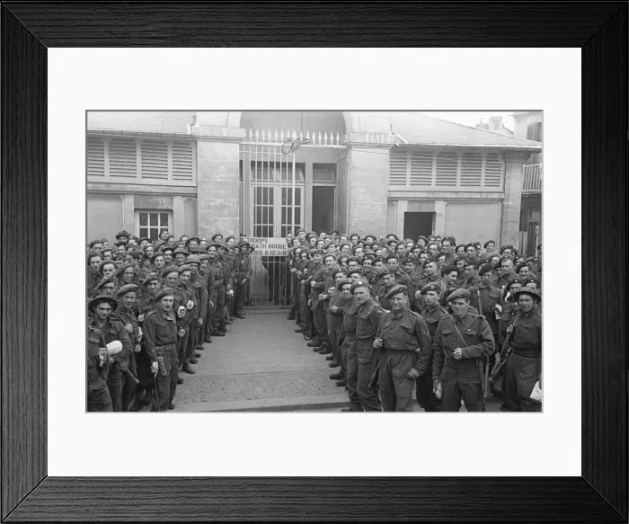 Framed Print : British troops outside the bath house in an unknown Normandy town in Northern France a Framed Print : British troops outside the bath house in an unknown Normandy town in Northern France a