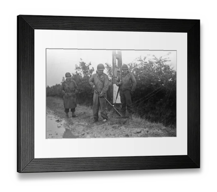 Framed Print : US Soldiers searching for land mines on the grass verges of the roads in Framed Print : US Soldiers searching for land mines on the grass verges of the roads in