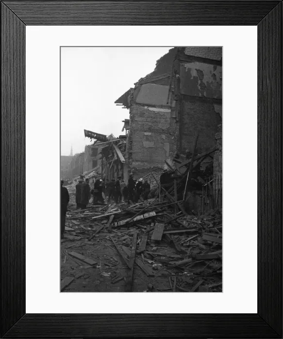 Framed Print : Rescue workers search the collapsed buildings of the Central London Ophthalmic Hospital Framed Print : Rescue workers search the collapsed buildings of the Central London Ophthalmic Hospital