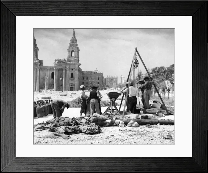 Framed Print : Maltese workmen hauling and measuring grain from one of the underground granaries in Framed Print : Maltese workmen hauling and measuring grain from one of the underground granaries in