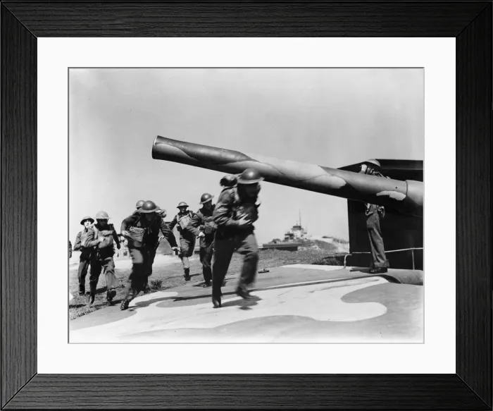 Framed Print : Soldiers manning one of the thousands of coastal defence guns against possible German