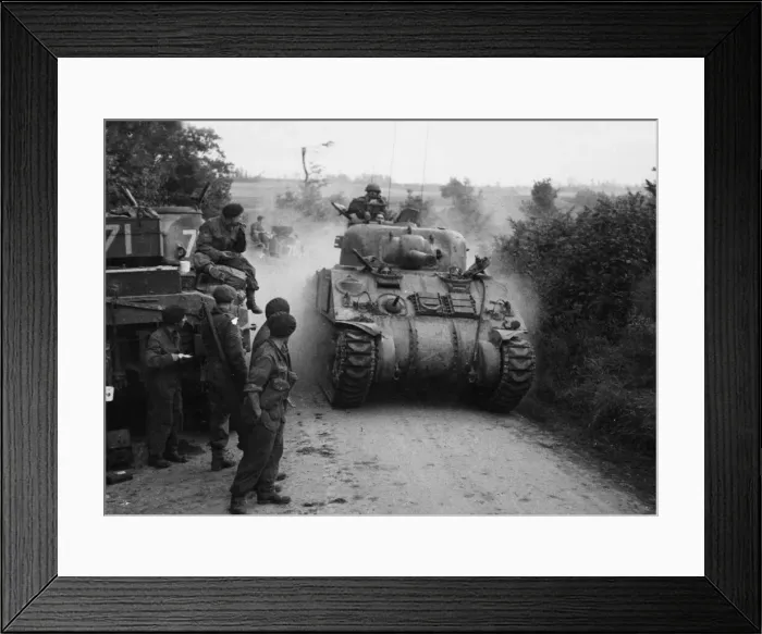 Framed Print : Sherman tanks pass other tanks and crew waiting for the order to advance on Caen Framed Print : Sherman tanks pass other tanks and crew waiting for the order to advance on Caen