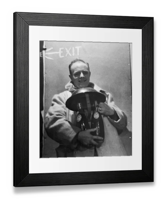 Framed Print : A spotter in a city area finds the safe custody of his steel helmet for his two bottles Framed Print : A spotter in a city area finds the safe custody of his steel helmet for his two bottles
