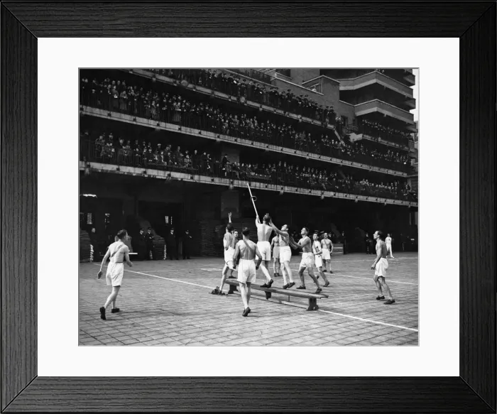 Framed Print : Physical training competition by London Fire Force. Opposing side man throws a ring Framed Print : Physical training competition by London Fire Force. Opposing side man throws a ring