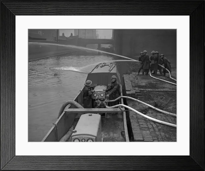 Framed Print : Fire Float Practice. Members of the Birmingham Auxiliary Fire Service Naval Detachment