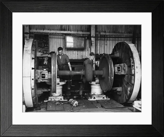 Framed Print : Trainees at a Royal Engineers Transportation training centre repair locomotive wheels in Framed Print : Trainees at a Royal Engineers Transportation training centre repair locomotive wheels in