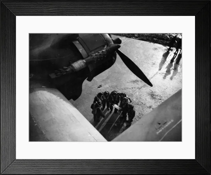 Framed Print : The crew of a Stirling bomber consulting a map. February 1942 Framed Print : The crew of a Stirling bomber consulting a map. February 1942