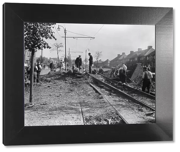 Workmen repair the tramlines at Tyburn Road, Birmingham following an air raid on the city