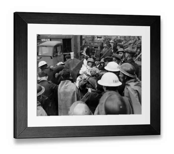 Framed Print : Casualties being removed from bombed houses in Southern England. 12th June 1944 Framed Print : Casualties being removed from bombed houses in Southern England. 12th June 1944