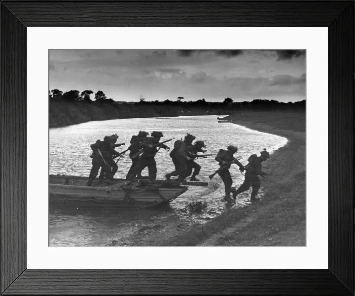 Framed Print : Invasion training in Southern England. Infantry are seen leaving a small assault boat Framed Print : Invasion training in Southern England. Infantry are seen leaving a small assault boat