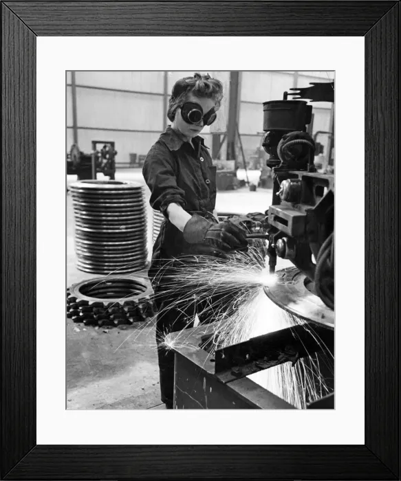 Framed Print : A factory worker cutting steel in a tank factory. 26th October 1942 Framed Print : A factory worker cutting steel in a tank factory. 26th October 1942
