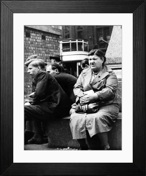 Framed Print : A woman hears the news of the general election in Albert Square, Manchester Framed Print : A woman hears the news of the general election in Albert Square, Manchester