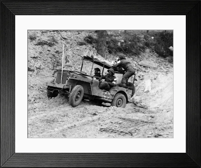 Framed Print : A wounded soldier is transported by jeep back to a Regimental Aid Post Framed Print : A wounded soldier is transported by jeep back to a Regimental Aid Post