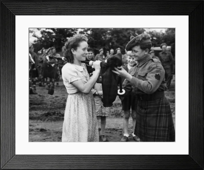 Framed Print : At a football match held at Delivrand, in Normandy, a Scottish Pipe band Framed Print : At a football match held at Delivrand, in Normandy, a Scottish Pipe band