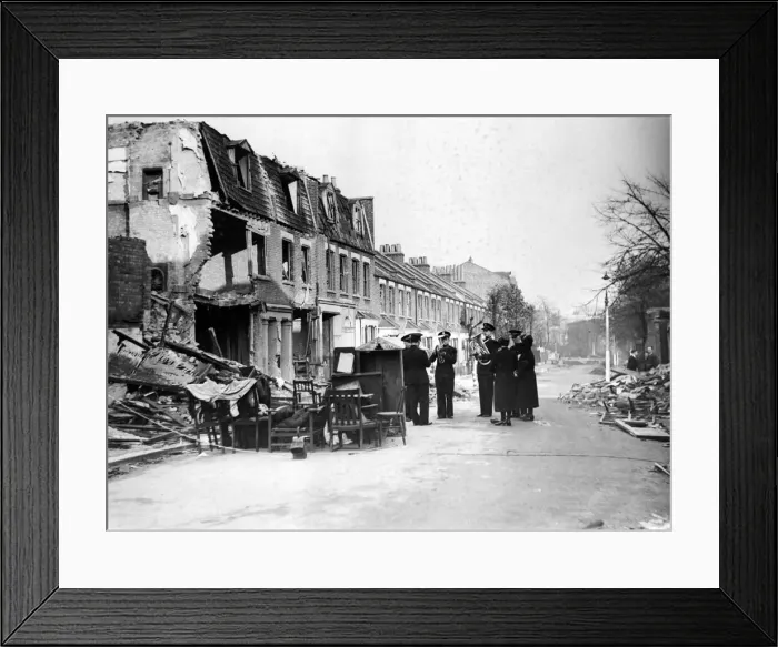 Framed Print : They carry on each Sunday at their usual corner although now the scene of ruin Framed Print : They carry on each Sunday at their usual corner although now the scene of ruin
