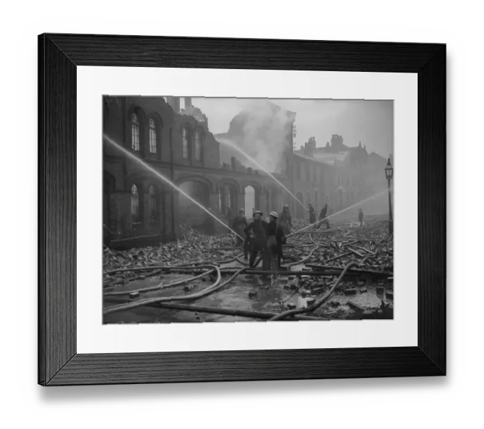 Framed Print : Firemen dampening down fires in Moseley Street, Birmingham the morning after a heavy