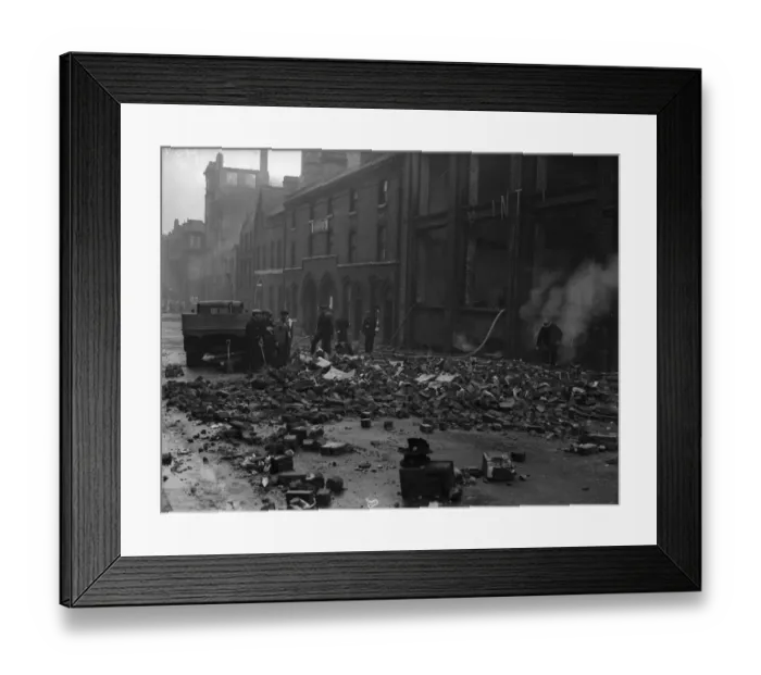 Framed Print : Firemen dampening down fires in Cornwall Street, Birmingham the morning after a heavy