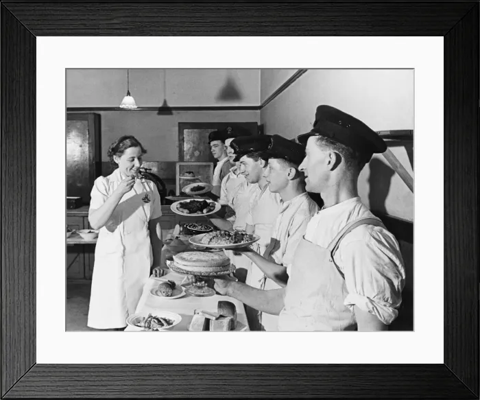Framed Print : Miss Lloyd-Davies tries the dishes of her pupils at a cooking school in Suffolk Framed Print : Miss Lloyd-Davies tries the dishes of her pupils at a cooking school in Suffolk