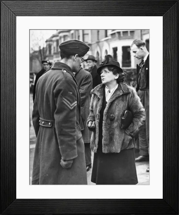 Framed Print : Miss Ellen Wilkinson sympathising with Corporal LG Biddle, whose twins, aged 5 Framed Print : Miss Ellen Wilkinson sympathising with Corporal LG Biddle, whose twins, aged 5