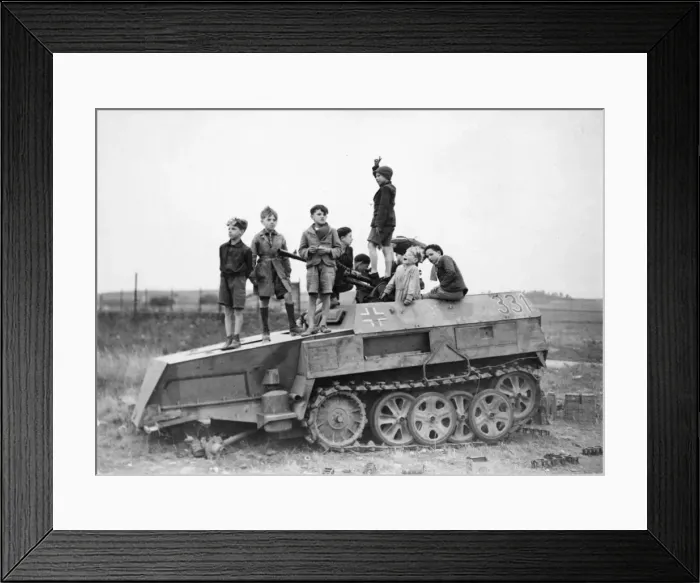 Framed Print : Picture shows children playing on a wrecked Nazi vehicle Framed Print : Picture shows children playing on a wrecked Nazi vehicle