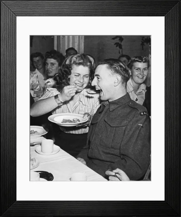 Framed Print : Members of the West Mersey W. L. A and their boy friends attend a Harvest Home supper in a Framed Print : Members of the West Mersey W. L. A and their boy friends attend a Harvest Home supper in a
