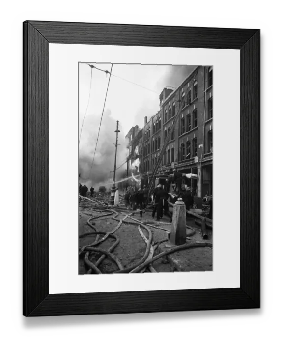 Framed Print : Fire fighters and emergency workers fight a fire at Brown Brothers, Great Eastern Street