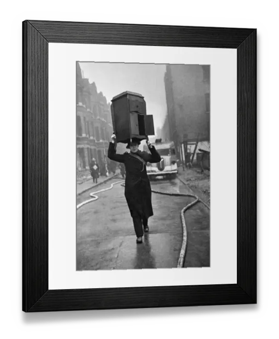 Framed Print : Fire crews, police and ARP wardens help salvage furniture from properties close to