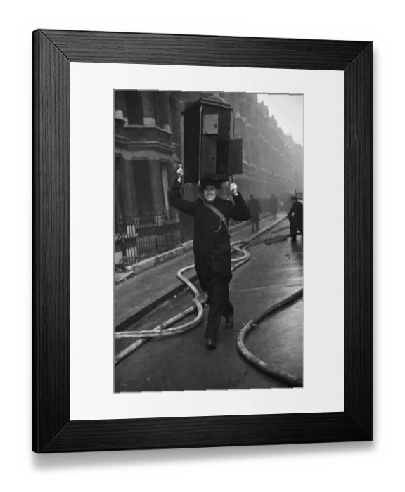 Framed Print : Fire crews, police and ARP wardens help salvage furniture from properties close to