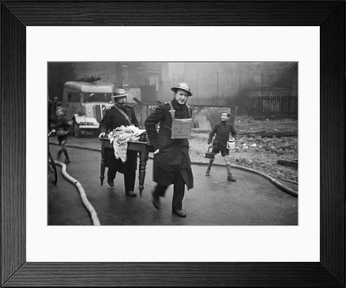 Framed Print : Fire crews, police and ARP wardens help salvage furniture from properties close to