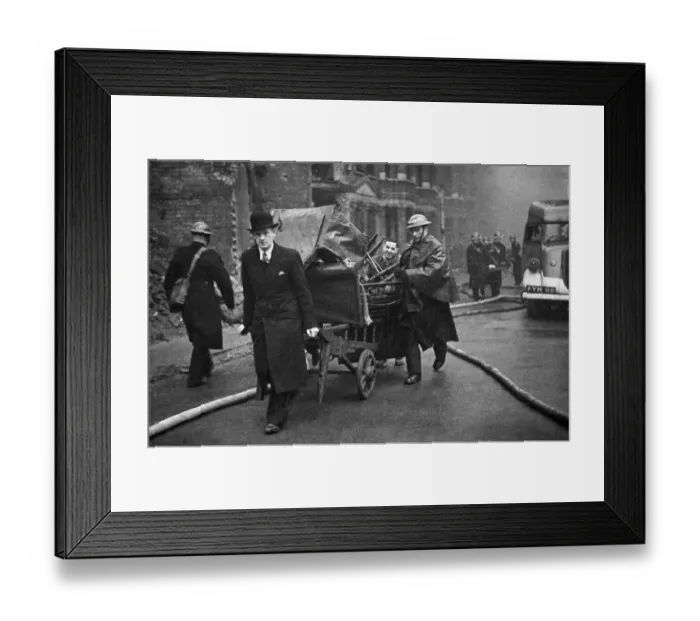 Framed Print : Fire crews, police and ARP wardens help salvage furniture from properties close to