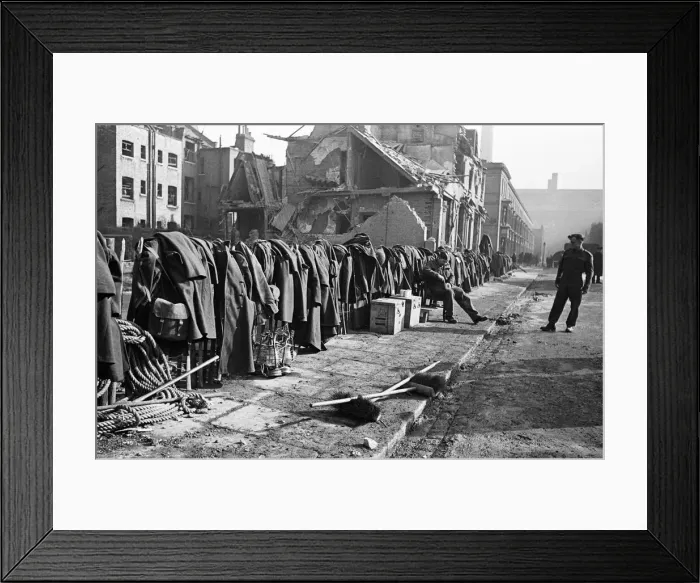 Framed Print : Soldiers discarded tunics and coats as they help with the clean up of Chelsea following Framed Print : Soldiers discarded tunics and coats as they help with the clean up of Chelsea following