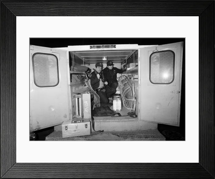 Framed Print : Two New York Policemen in the back of their truck with their equipment Framed Print : Two New York Policemen in the back of their truck with their equipment