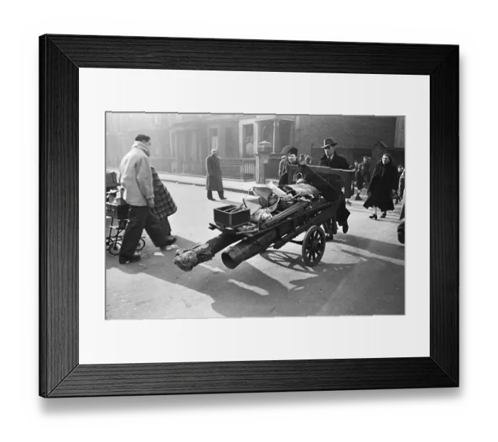 Framed Print : Chelsea residents with the few belonging salvaged from their bombed out following a raid