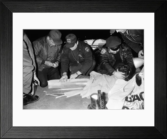 Framed Print : A young child who broke his leg roller skating being given medical assistance by New York Framed Print : A young child who broke his leg roller skating being given medical assistance by New York
