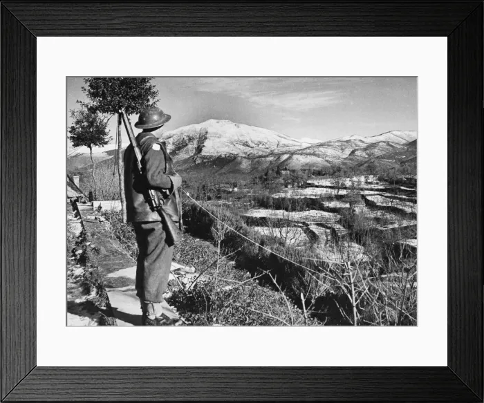Framed Print : Driver C. A. Langford looks over snow covered territory of an American held sector