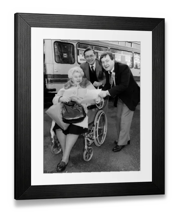 Framed Print : Health Secretary Norman Fowler (centre) sees off Mrs Eva Barnes at the start of a