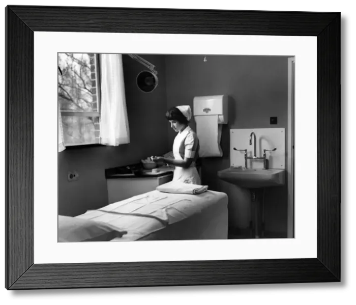 Framed Print : Nurse Phoebe Barrett, aged 22, in one of the consultant examination rooms at Birmingham Framed Print : Nurse Phoebe Barrett, aged 22, in one of the consultant examination rooms at Birmingham