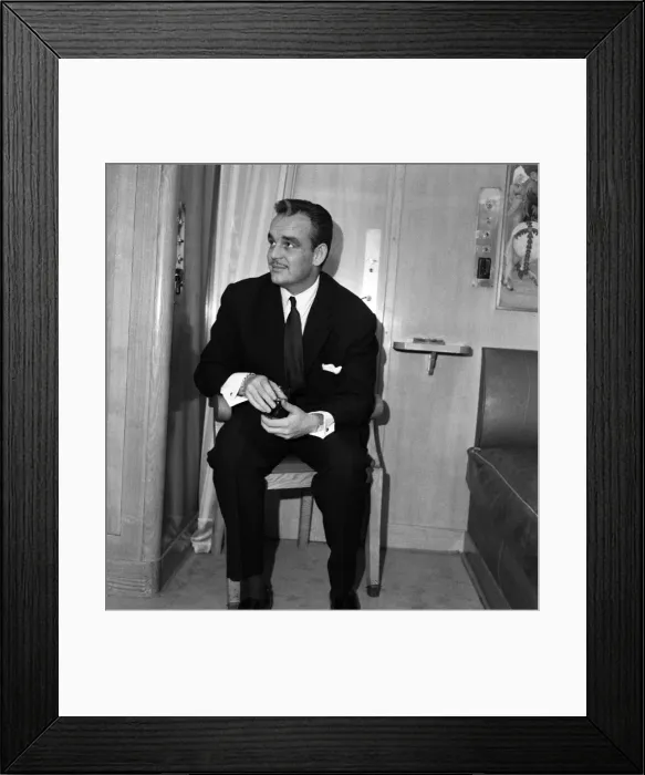 Framed Print : Prince Rainier of Monaco in his suite aboard the ile de France. 22nd March 1956 Framed Print : Prince Rainier of Monaco in his suite aboard the ile de France. 22nd March 1956