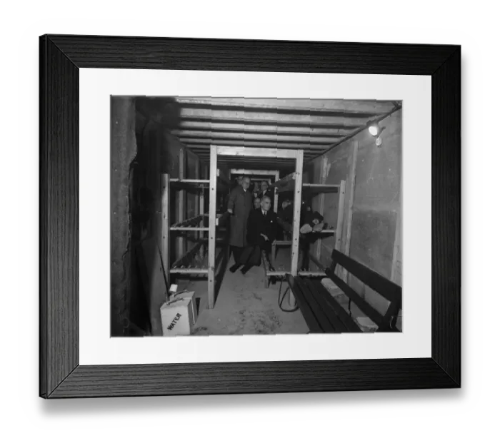 Framed Print : Mr. Walter Higgs. M. P. tries out one of the new bunks in a public air raid shelter while