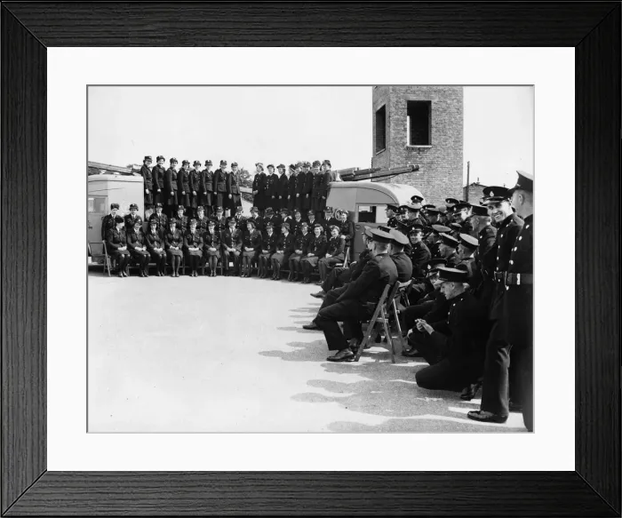 Framed Print : Female firefighters pose with their commandant for a photograph before leaving their