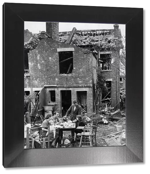 Their home destroyed by a German V-1 flying bomb, the Metcalf family carrying on with