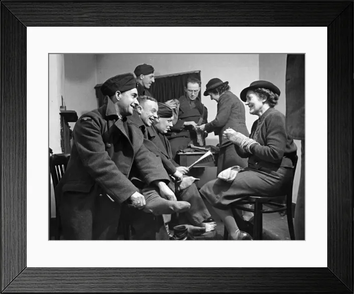 Framed Print : Soldiers have their socks repaired. February 1942