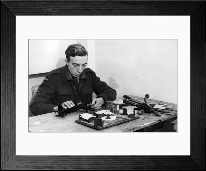 Framed Print : A British LAC enjoying spare time with a model aircraft kit. 7th December 1944 Framed Print : A British LAC enjoying spare time with a model aircraft kit. 7th December 1944