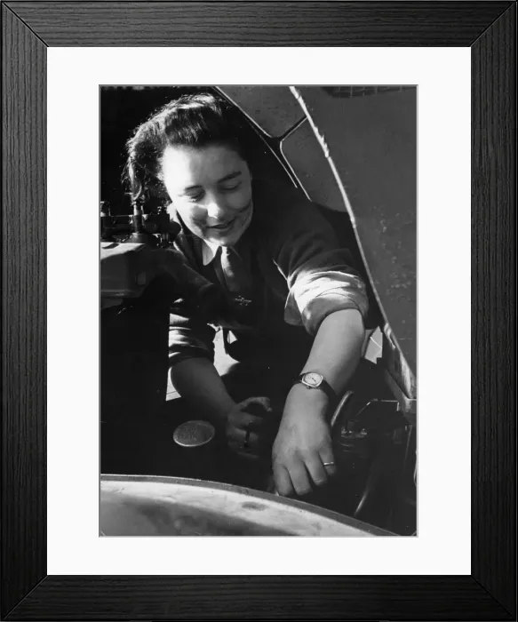 Framed Print : A mechanic of the Auxiliary territorial Service (ATS) busy at work on repairs to a Framed Print : A mechanic of the Auxiliary territorial Service (ATS) busy at work on repairs to a